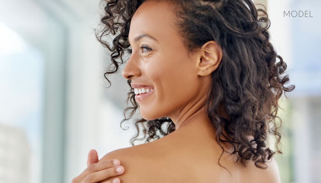 Model looking over shoulder smiling