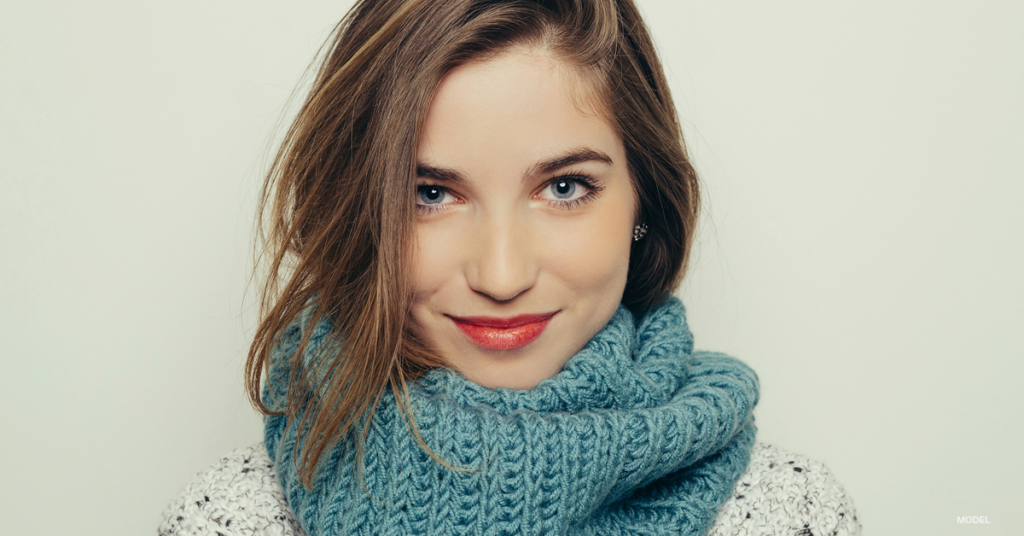 Woman with scarf around neck