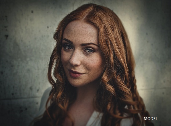 Redheaded woman looking at camera