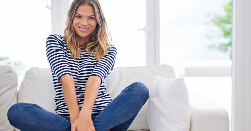 Woman smiling after CoolSculpting treatment in Des Moines , Iowa