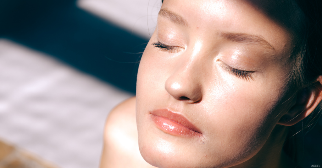 A woman poses in the sun.