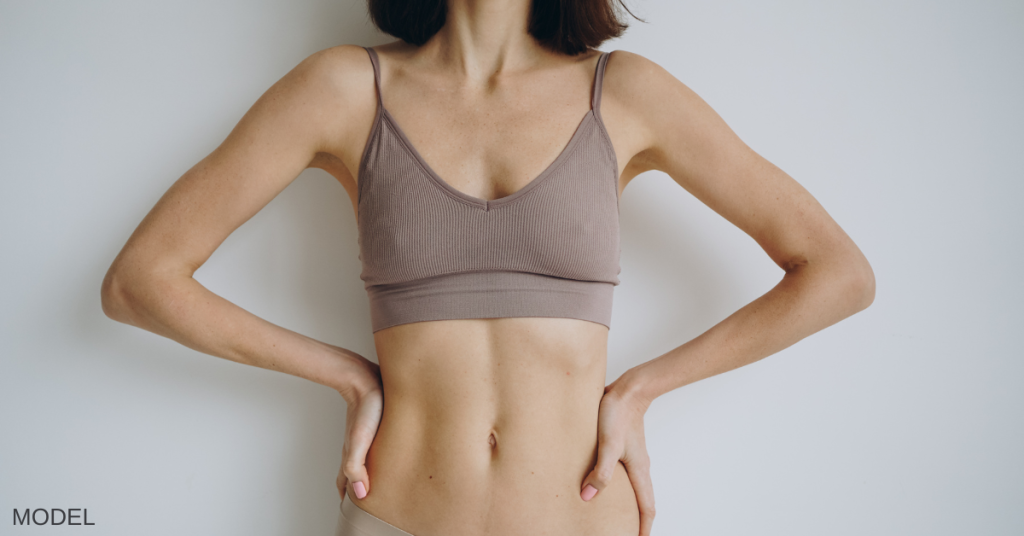 Woman in her bra and underwear with her hands on her hips (model)