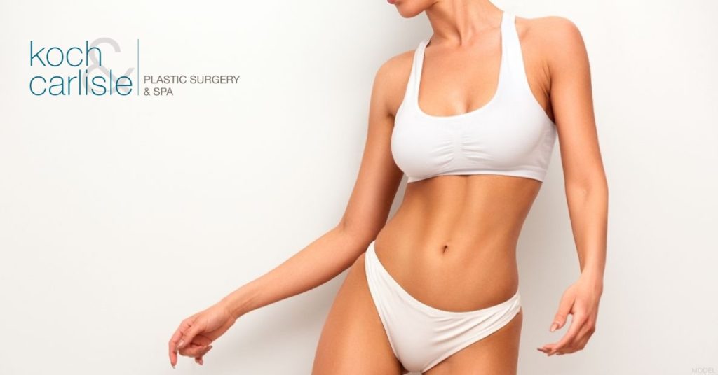 A woman in white undergarments in front of a beige background. (Model) Koch & Carlisle Plastic Surgery & Spa Logo