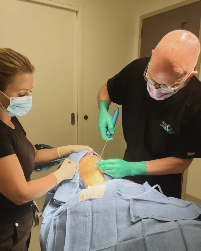 📸: Dr. Brent Koch performing facial liposuction at our in-office operating suite 

Facial liposuction is a highly effective procedure which is often performed in conjunction with other procedures such as chin augmentation and facelift. 

At Koch & Carlisle Plastic Surgery, both Dr. Brent Koch and Dr. Cody Koch perform liposuction to help patients  remove excess fat from the jowls, neck, and chin for a dramatically improved appearance.

The results of facial liposuction include a reduction in the appearance of a "double chin," a more distinct profile and jaw line, as well as a more slender, defined neck. 

Our doctors can help you achieve improved facial contours by removing the fat from targeted areas of the face. As specialists in facial surgery, they have extensive training and more than 45 years of experience in performing facial procedures.

Check out our online photo gallery to see more from our patients:
➡ See more "Before & After" cases | https://www.kochandcarlisle.com/photo-gallery/